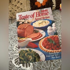 Taste of Home Cookbook with Red, Blue, Green, White Cover Art
